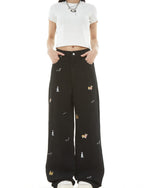 Washed distressed cartoon denim trousers