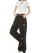 Washed distressed cartoon denim trousers