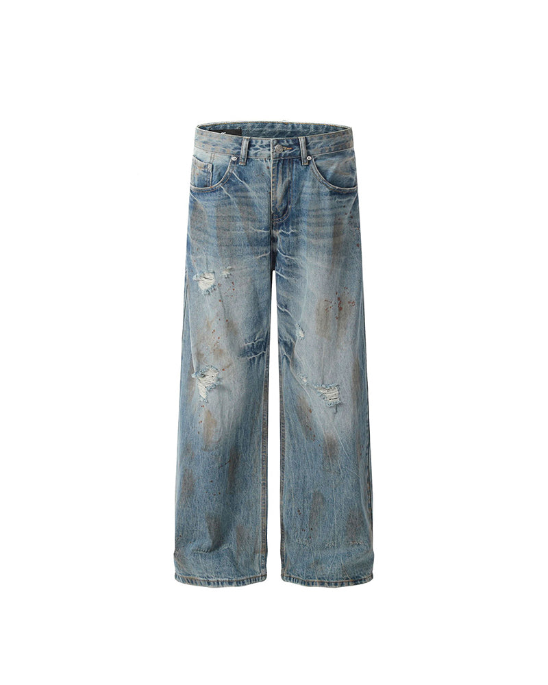 ヴィンテージのダメージ加工ウォッシュジーンズ