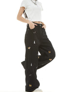 Washed distressed cartoon denim trousers