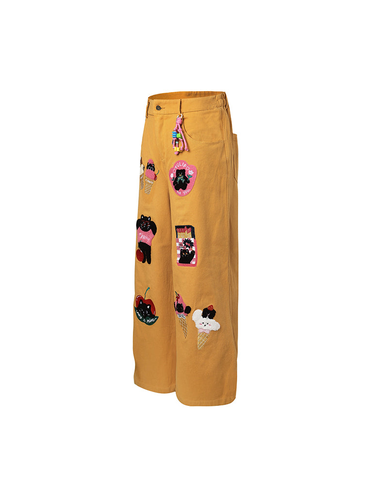 漫画の刺繍入りストレートレッグパンツ