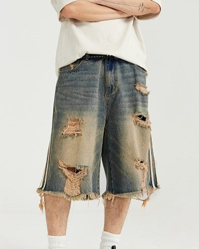 カラーブロックの破れたデニムショートパンツ