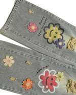 Distressed denim trousers