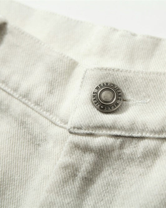 Distressed denim trousers