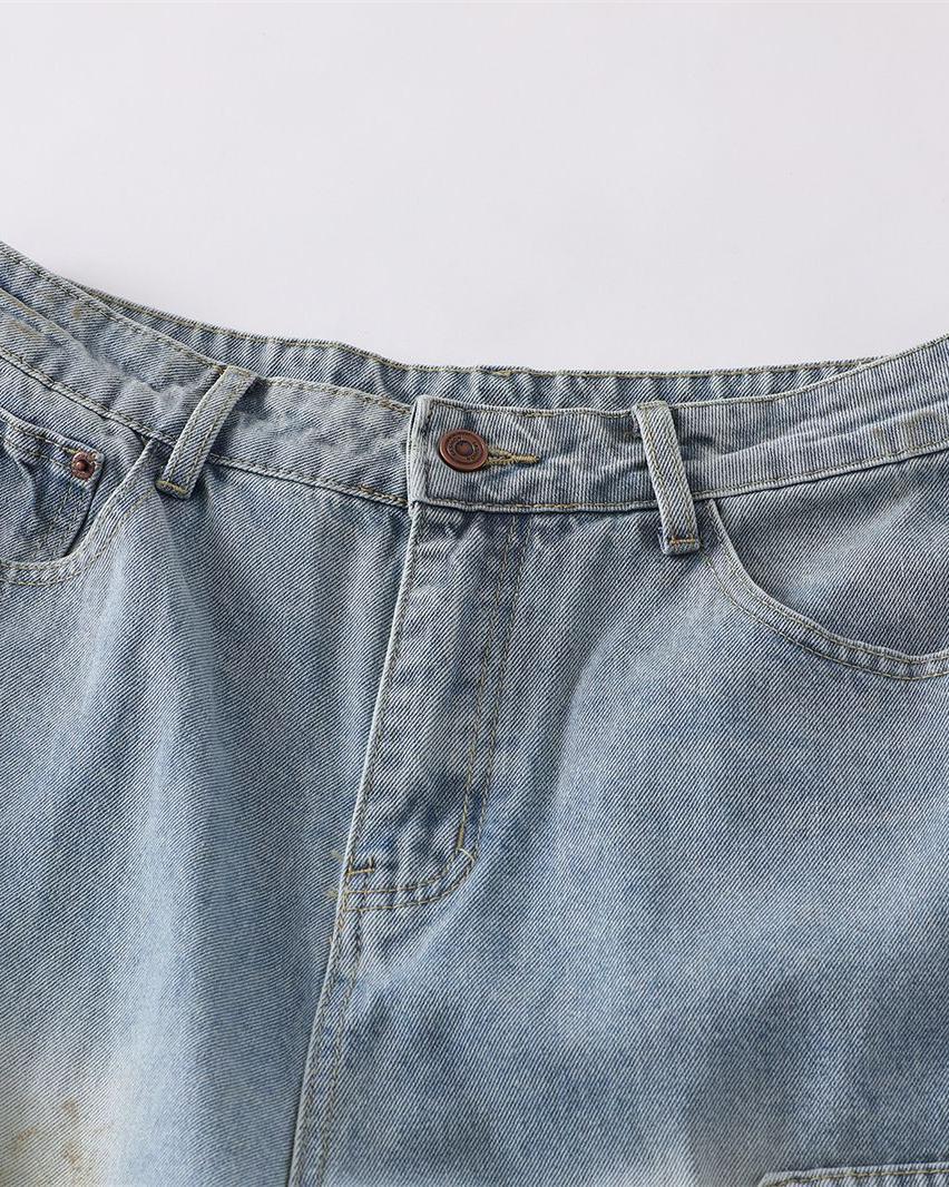 Distressed ripped denim trousers