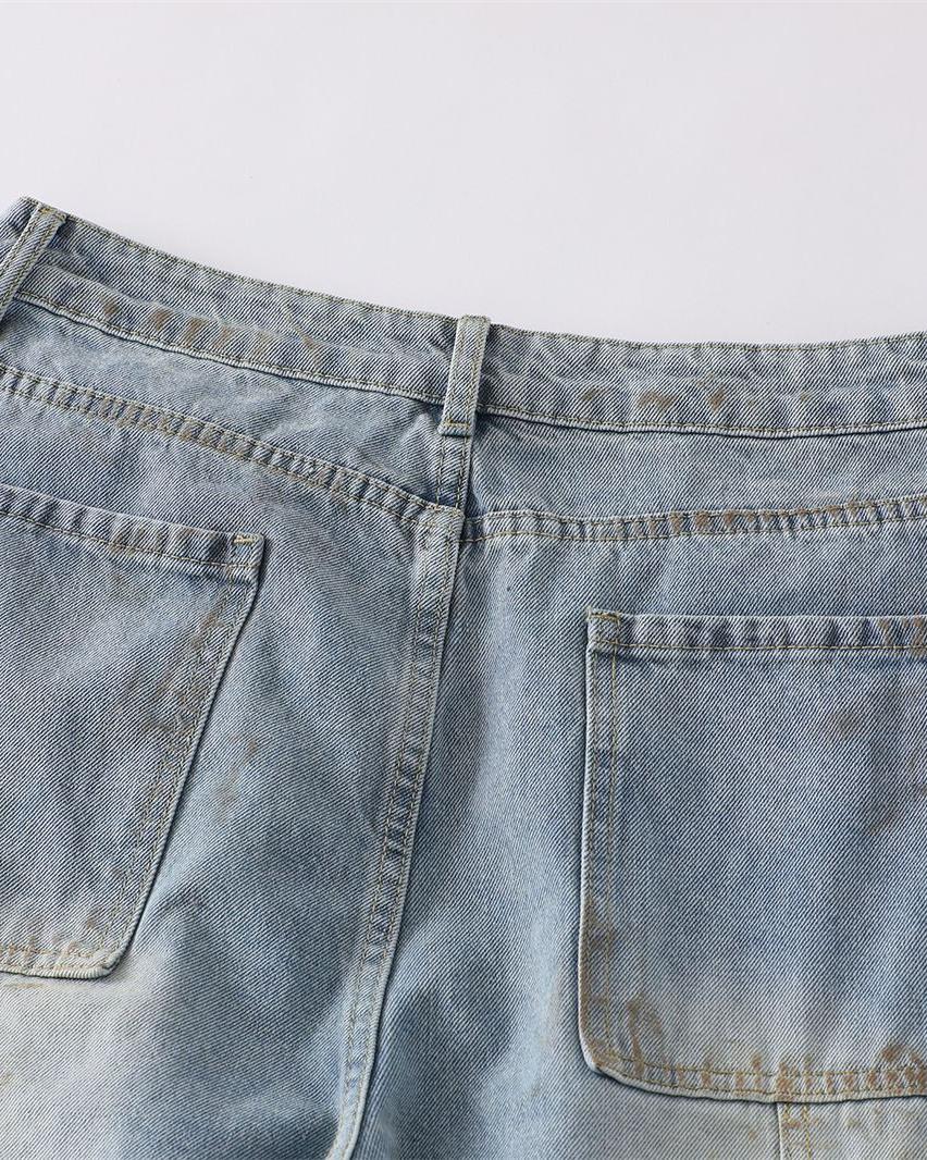 Distressed ripped denim trousers