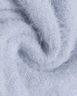 漫画風のゆったりカーディガンセーター