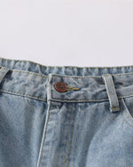 Distressed ripped denim trousers