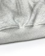 ダメージ加工のフード付きスウェットシャツ