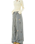 Washed distressed cartoon denim trousers
