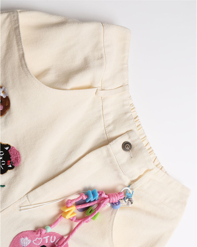 漫画の刺繍入りストレートレッグパンツ