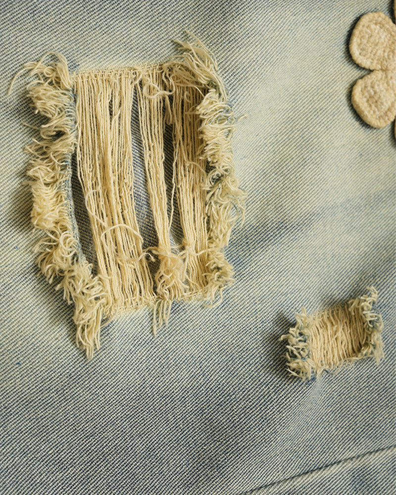 Distressed denim trousers