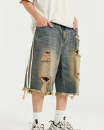 カラーブロックの破れたデニムショートパンツ