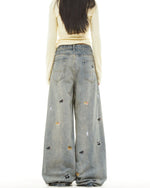 Washed distressed cartoon denim trousers