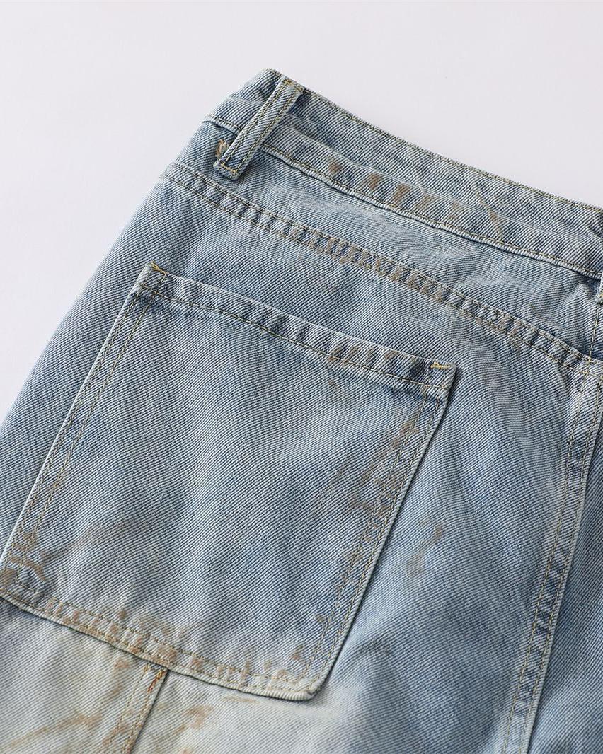 Distressed ripped denim trousers