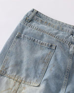 Distressed ripped denim trousers