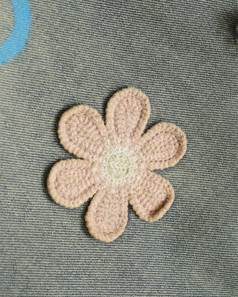 Distressed denim trousers