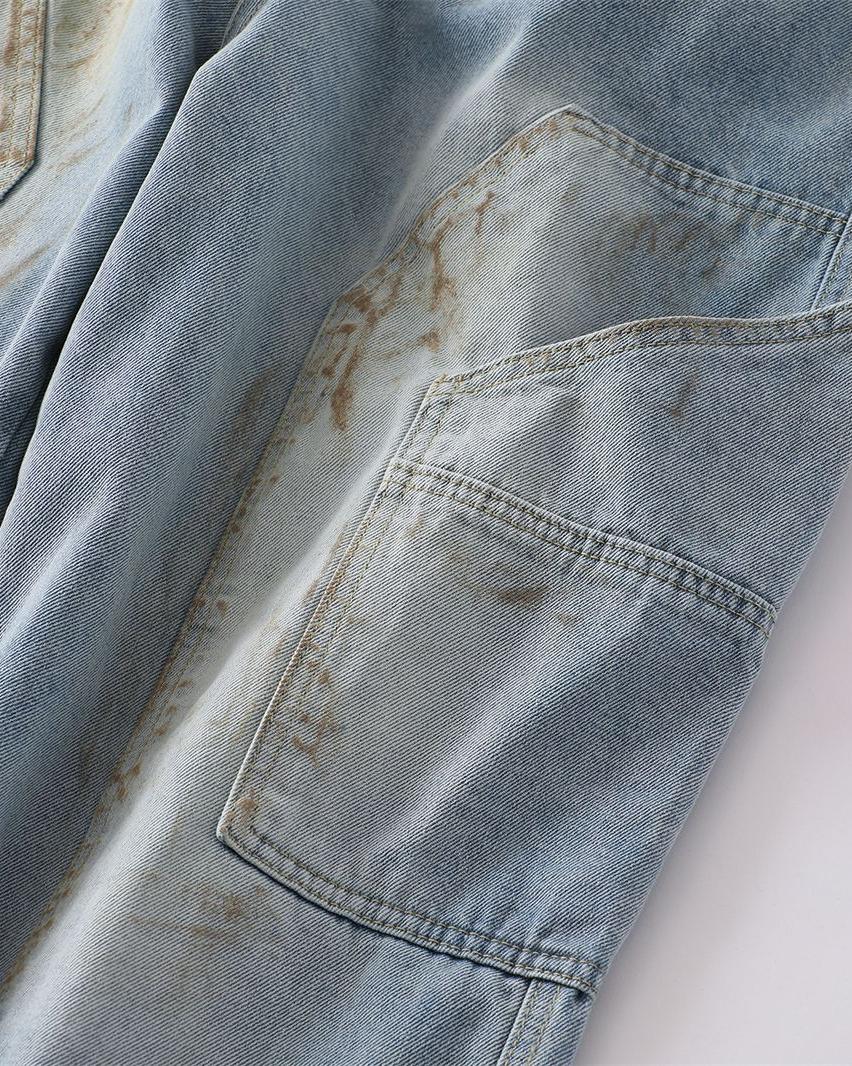 Distressed ripped denim trousers