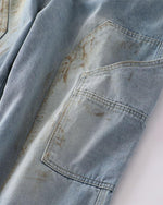 Distressed ripped denim trousers