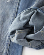 Distressed hand-painted jeans