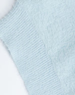 漫画風のゆったりとしたプルオーバーセーター