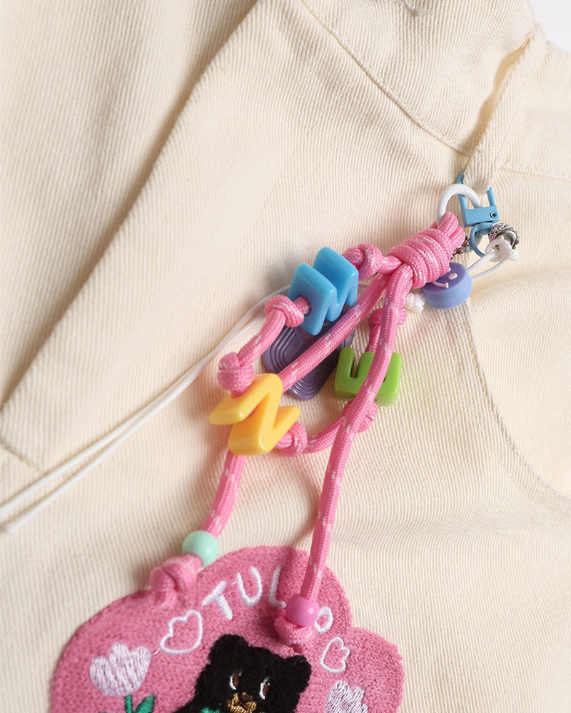 漫画の刺繍入りストレートレッグパンツ