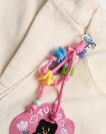 漫画の刺繍入りストレートレッグパンツ