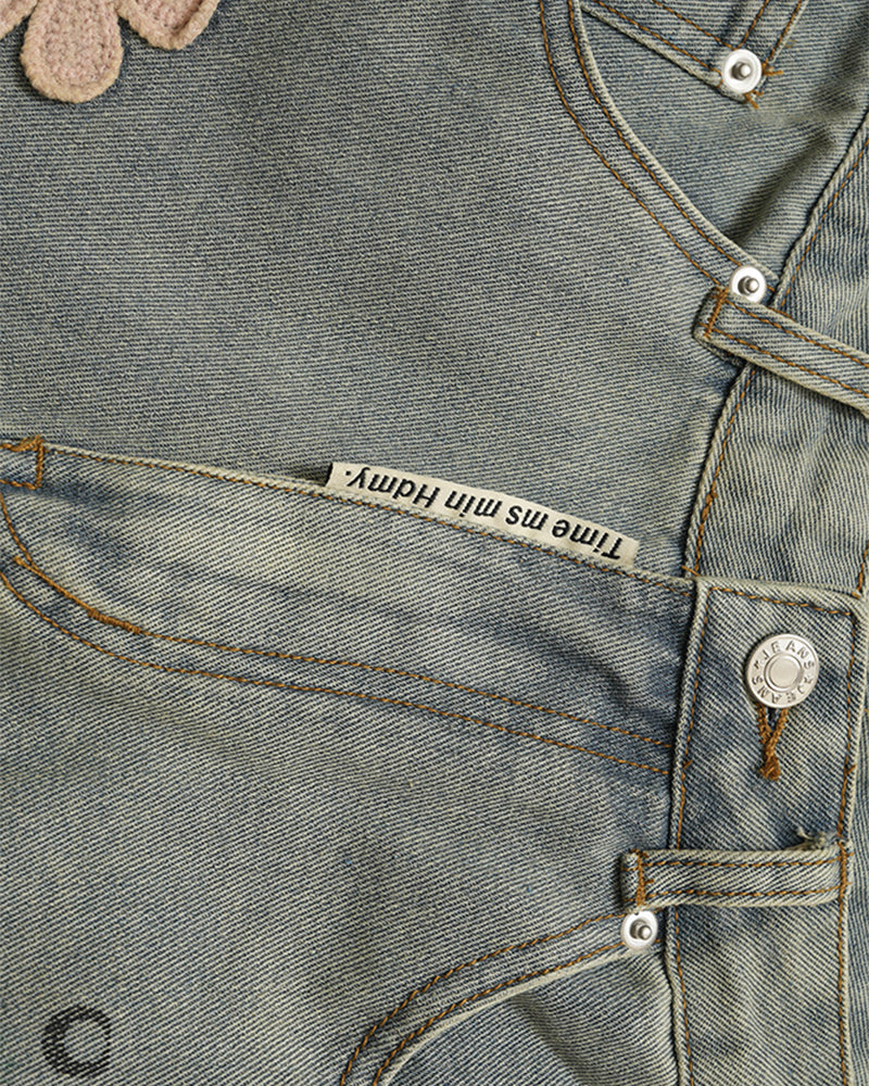 Distressed denim trousers