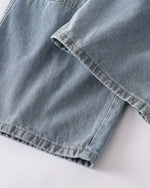 Distressed ripped denim trousers