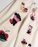 漫画の刺繍入りストレートレッグパンツ