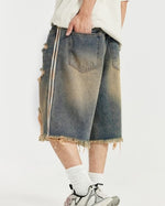 カラーブロックの破れたデニムショートパンツ