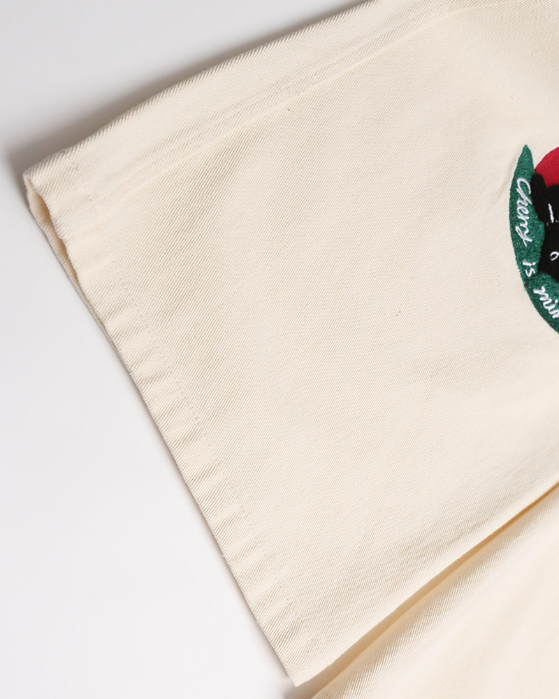 漫画の刺繍入りストレートレッグパンツ