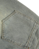 Distressed denim trousers