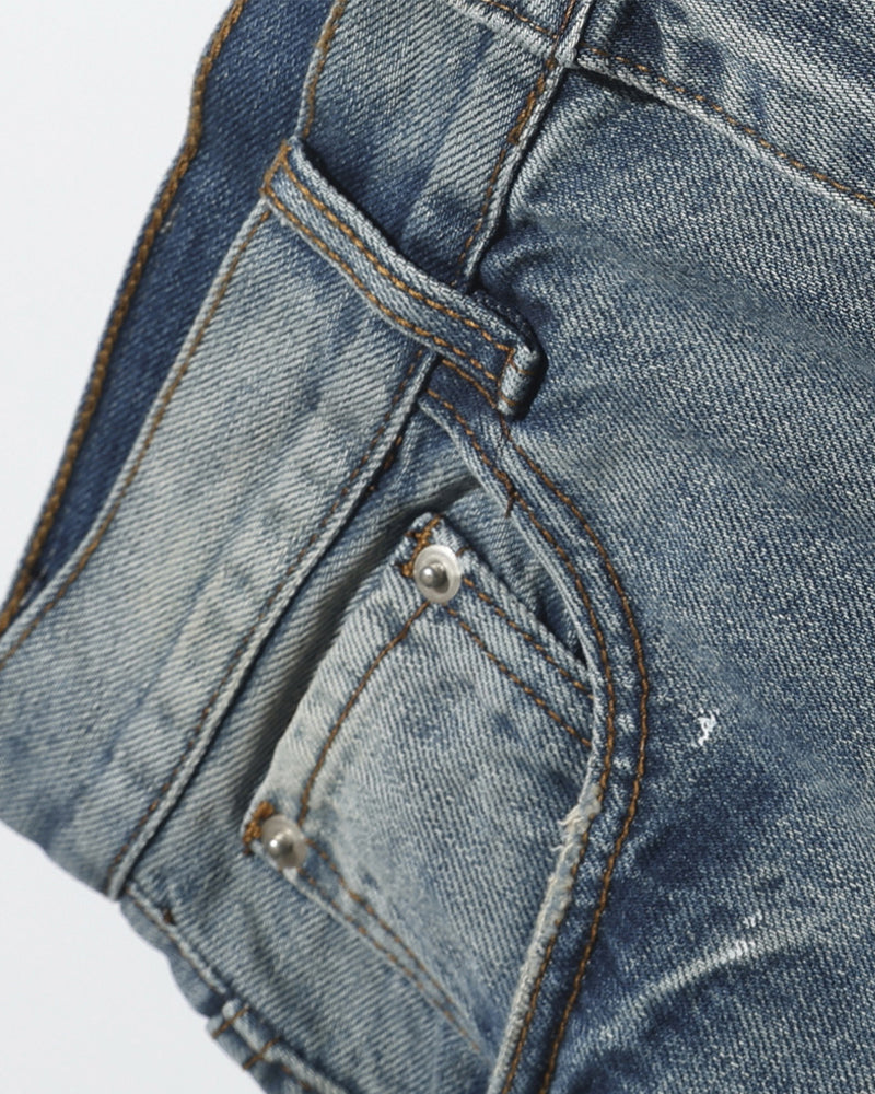 インクが飛び散ったデニムのクロップドパンツ