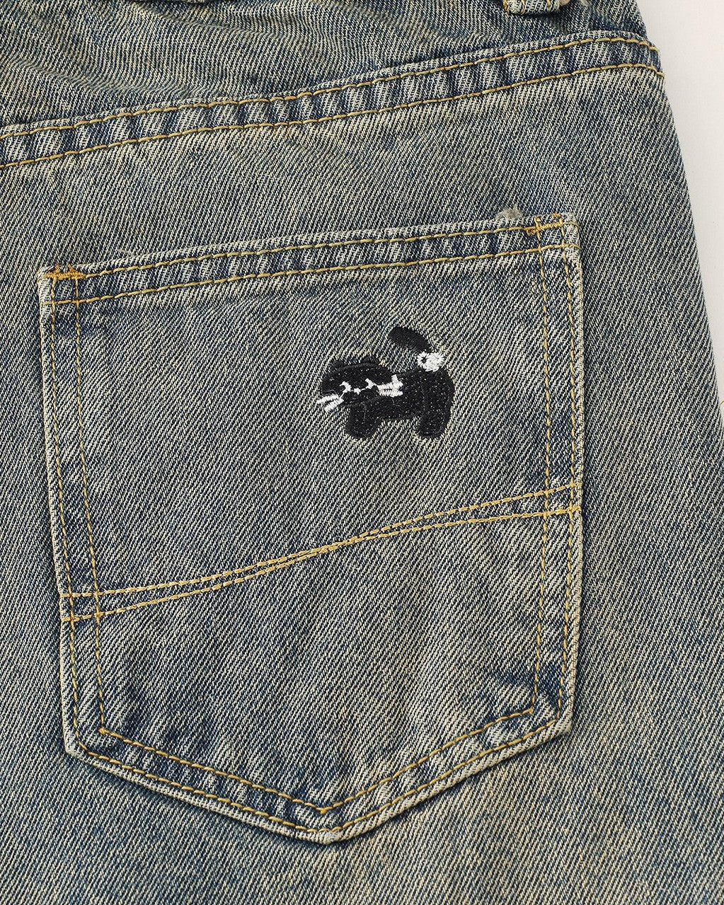 Washed distressed cartoon denim trousers