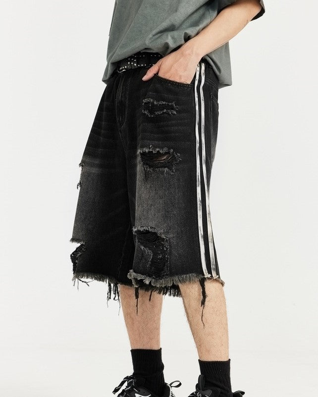 カラーブロックの破れたデニムショートパンツ