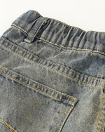 Washed distressed cartoon denim trousers