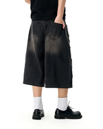 Distressed washed jeans