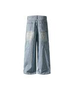 Distressed ripped denim trousers