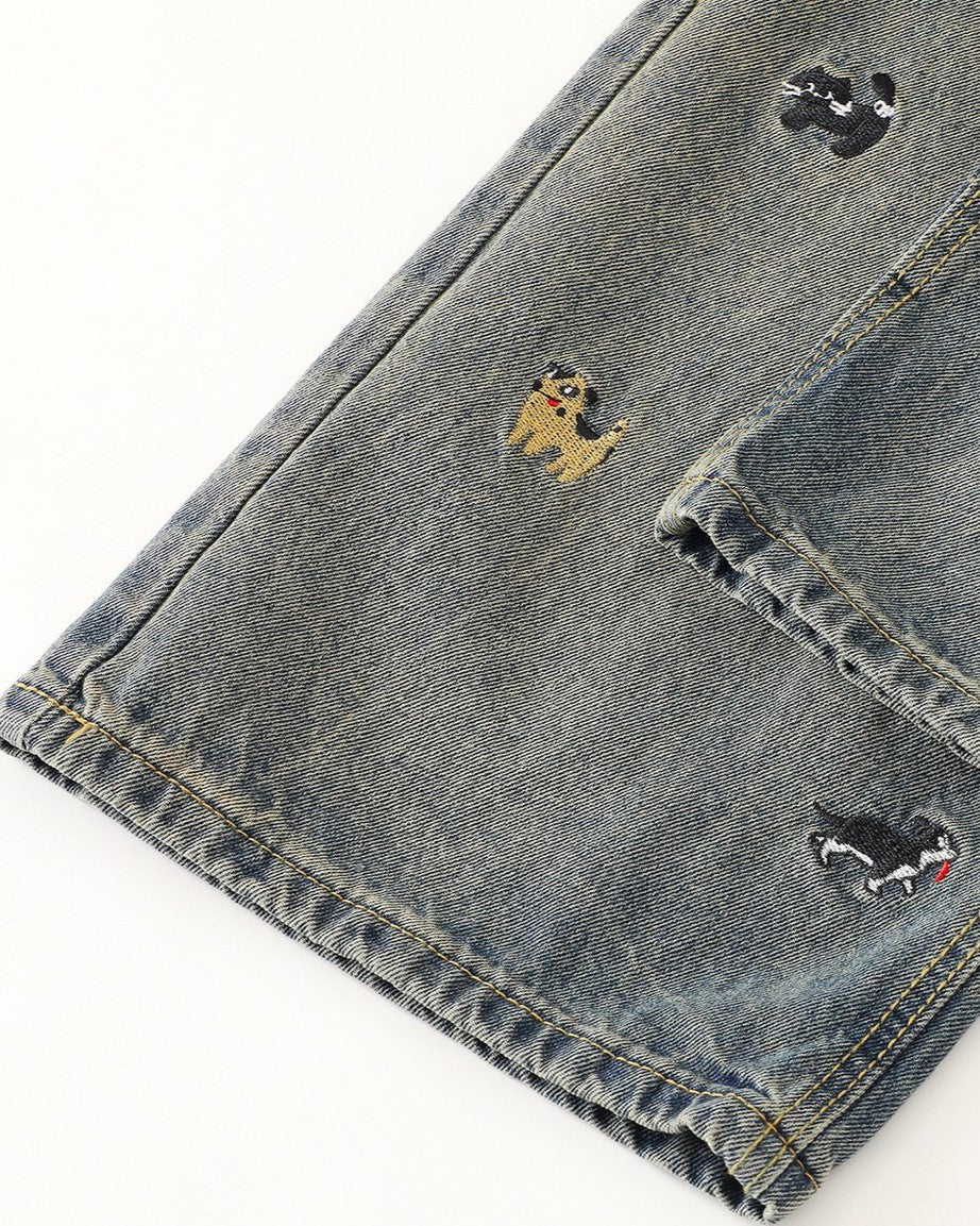 Washed distressed cartoon denim trousers