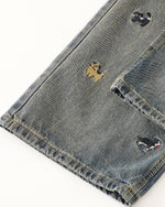 Washed distressed cartoon denim trousers