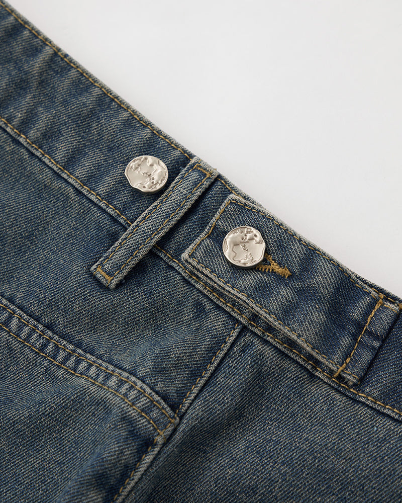 Distressed washed jeans