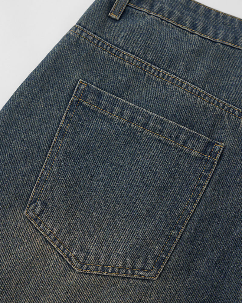 Distressed washed jeans