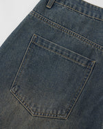 Distressed washed jeans