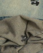 Washed distressed cartoon denim trousers