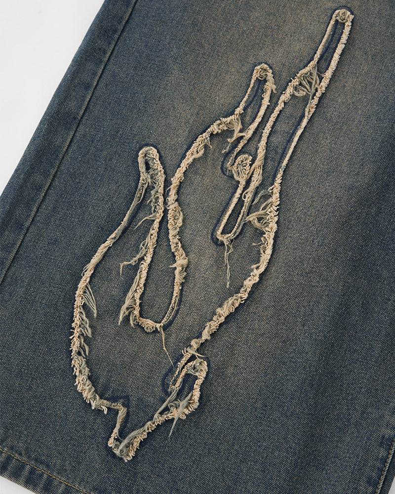 Distressed washed jeans