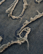 Distressed washed jeans