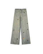 Washed distressed cartoon denim trousers