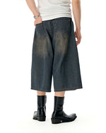 Distressed washed jeans