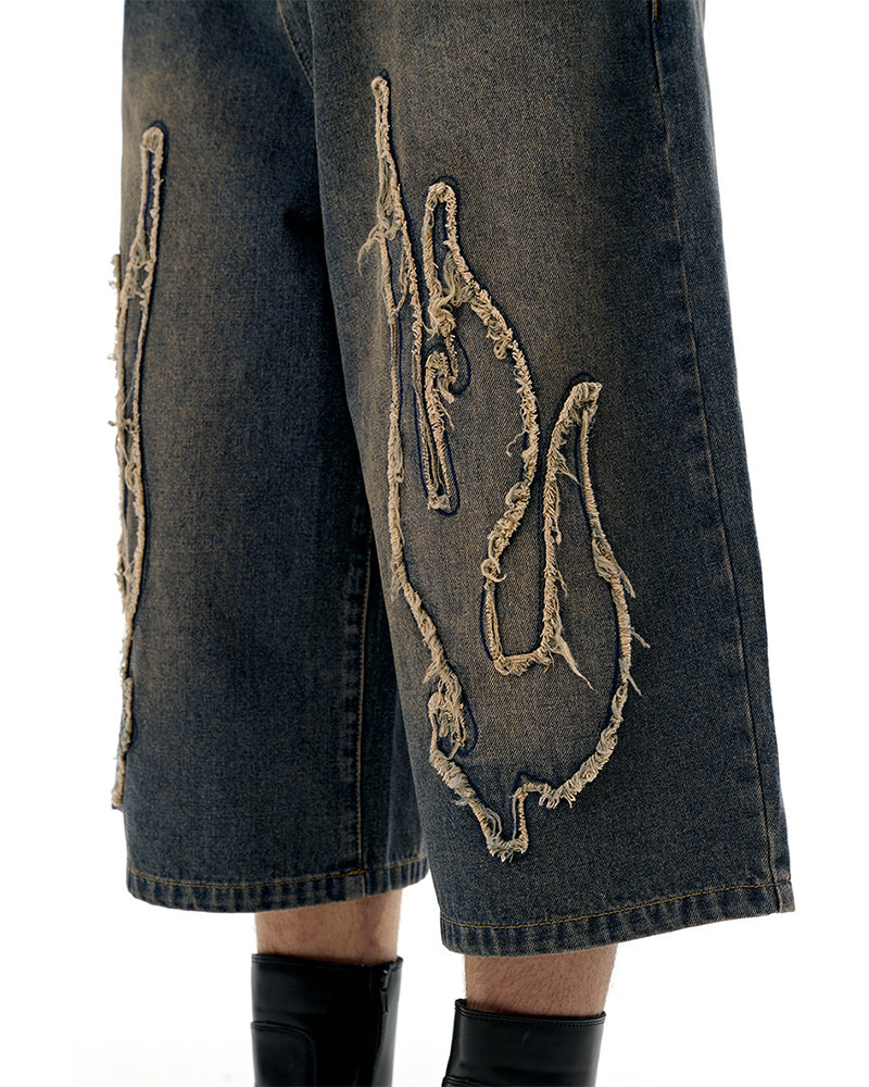 Distressed washed jeans